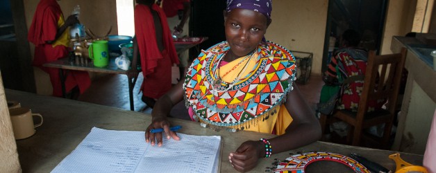 Penila updating the Olng'arua School kitchen records on a party day