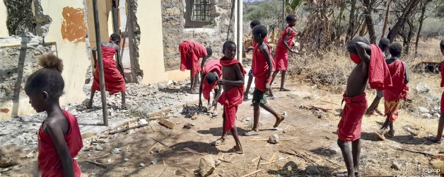 Kids clearing up their damaged school
